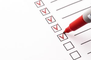 red-pen-checking-items-off-list