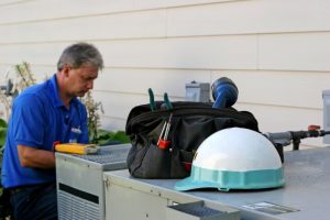 HVAC-technician-performing-maintenance
